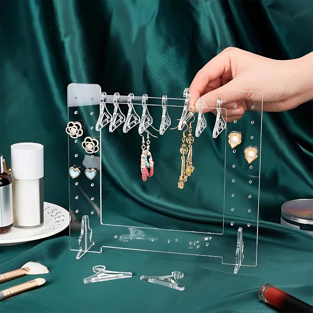 حامل أقراط اكريليك شفاف بتصميم شماعة ملابس